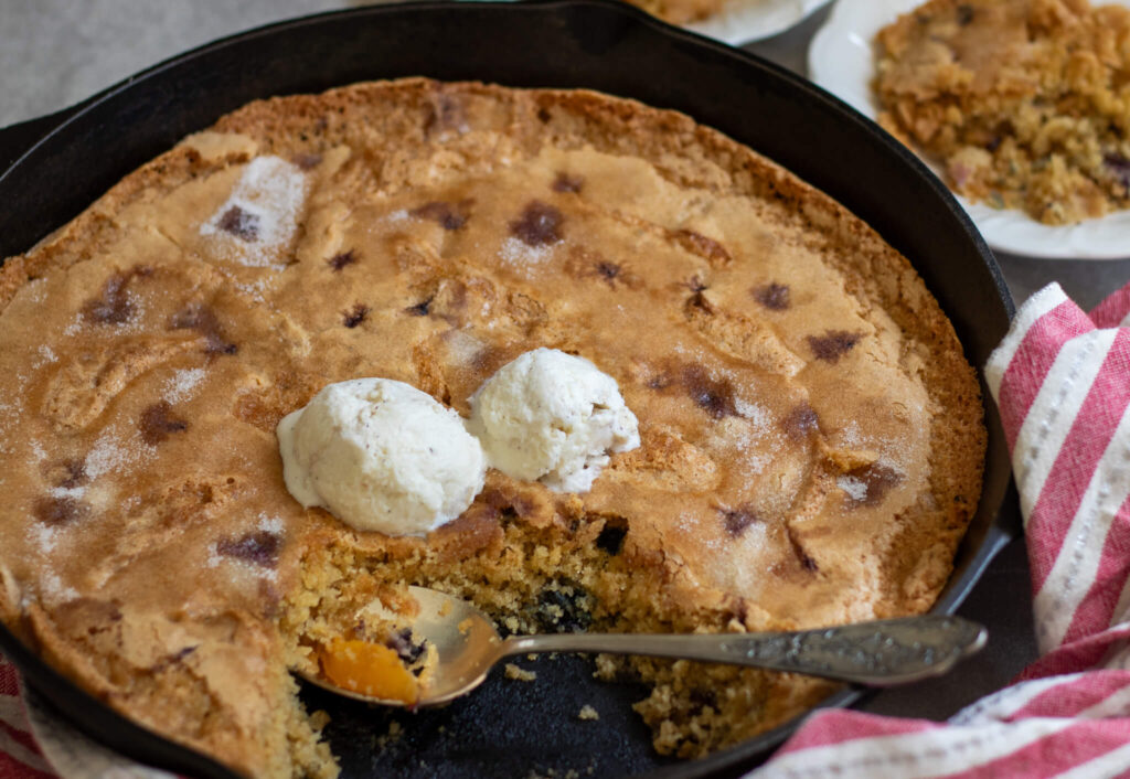 dairy free cobbler cake with ice cream on top