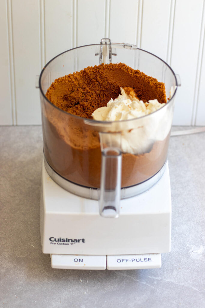 biscoff cookies in a food processor with cream cheese