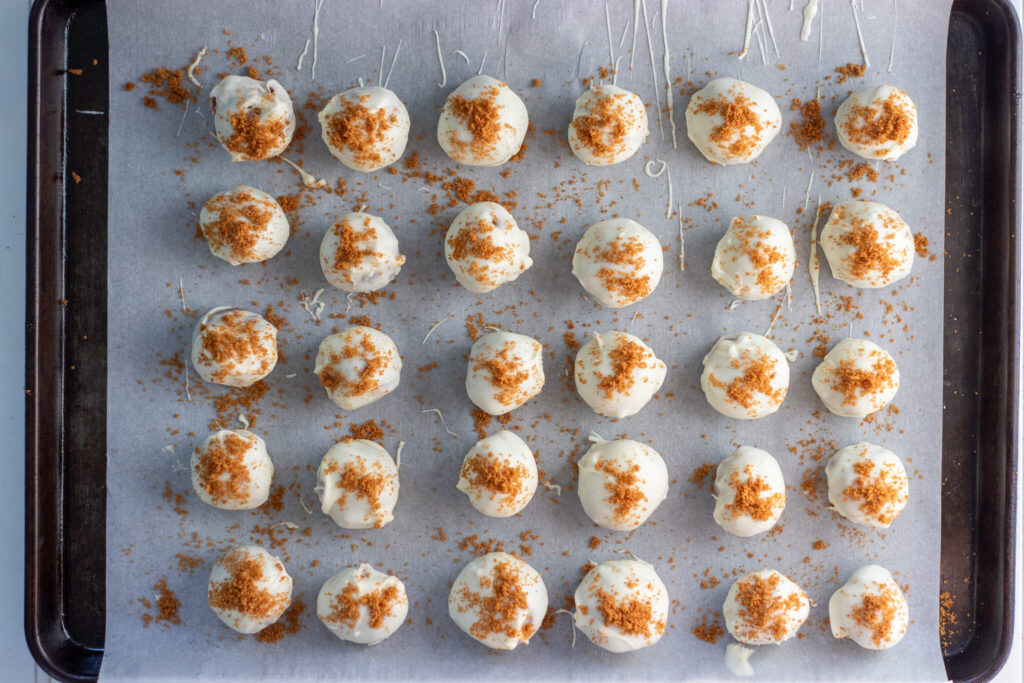 cookie butter truffles on a sheet pan