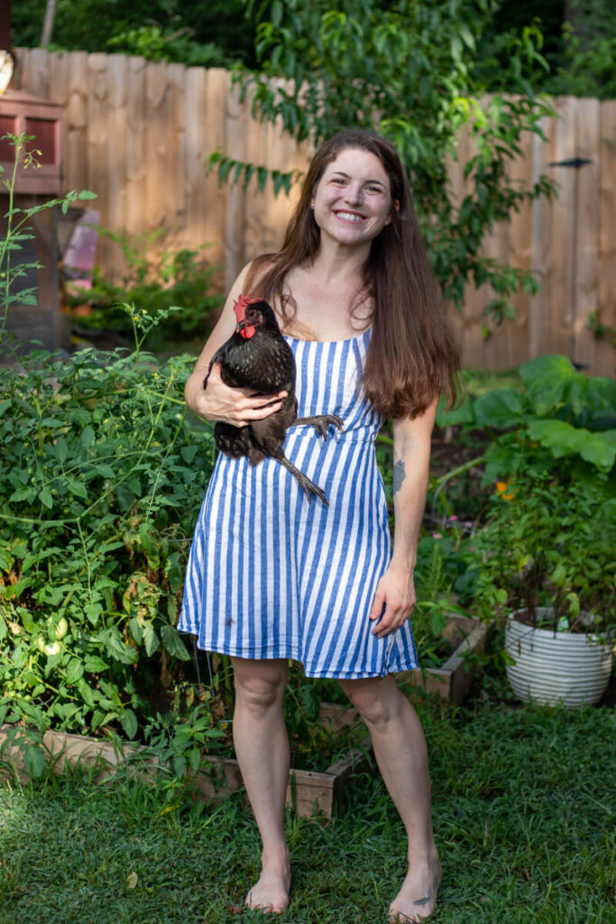 woman holding a chicken