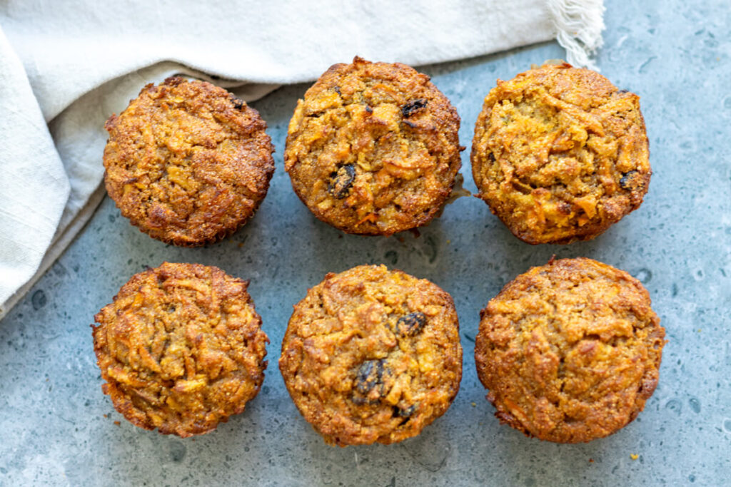 six carrot raisin muffins in a grid