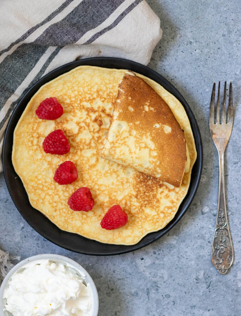 one sourdough crepe folded on a plate