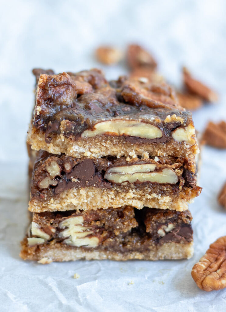 three chocolate pecan pie bars stacked together