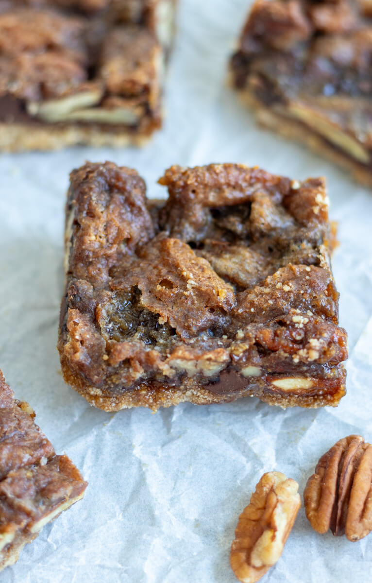 chocolate pecan pie bar with freshly milled flour in the center of a pan